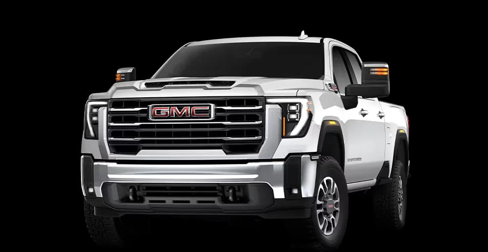 Mechanic performing post-winter diesel truck inspection